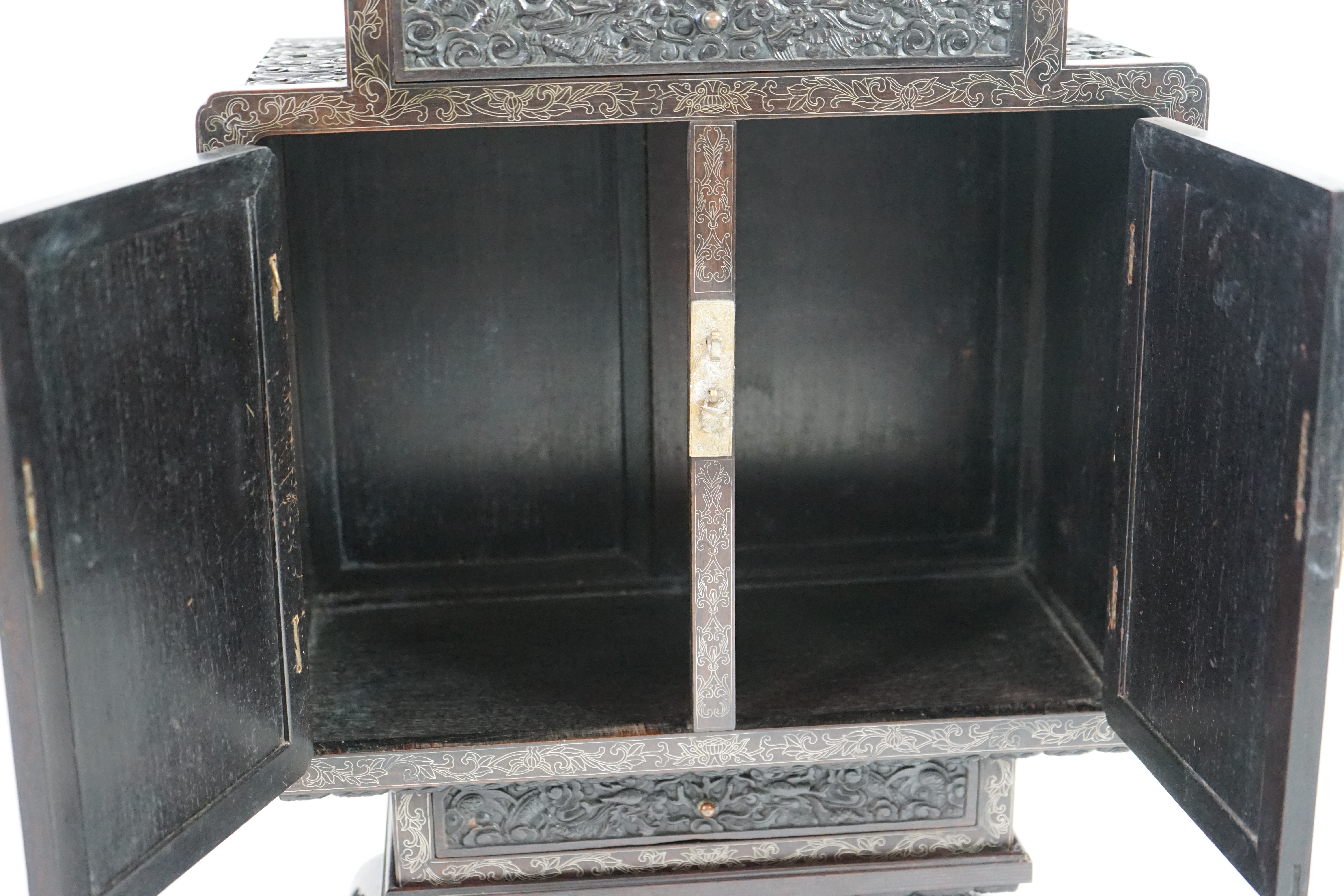An important pair of Chinese carved zitan and silver wire inlaid ‘cloud and dragon’ curio cabinets and stands, duobaoge, probably Imperial, late Qing dynasty